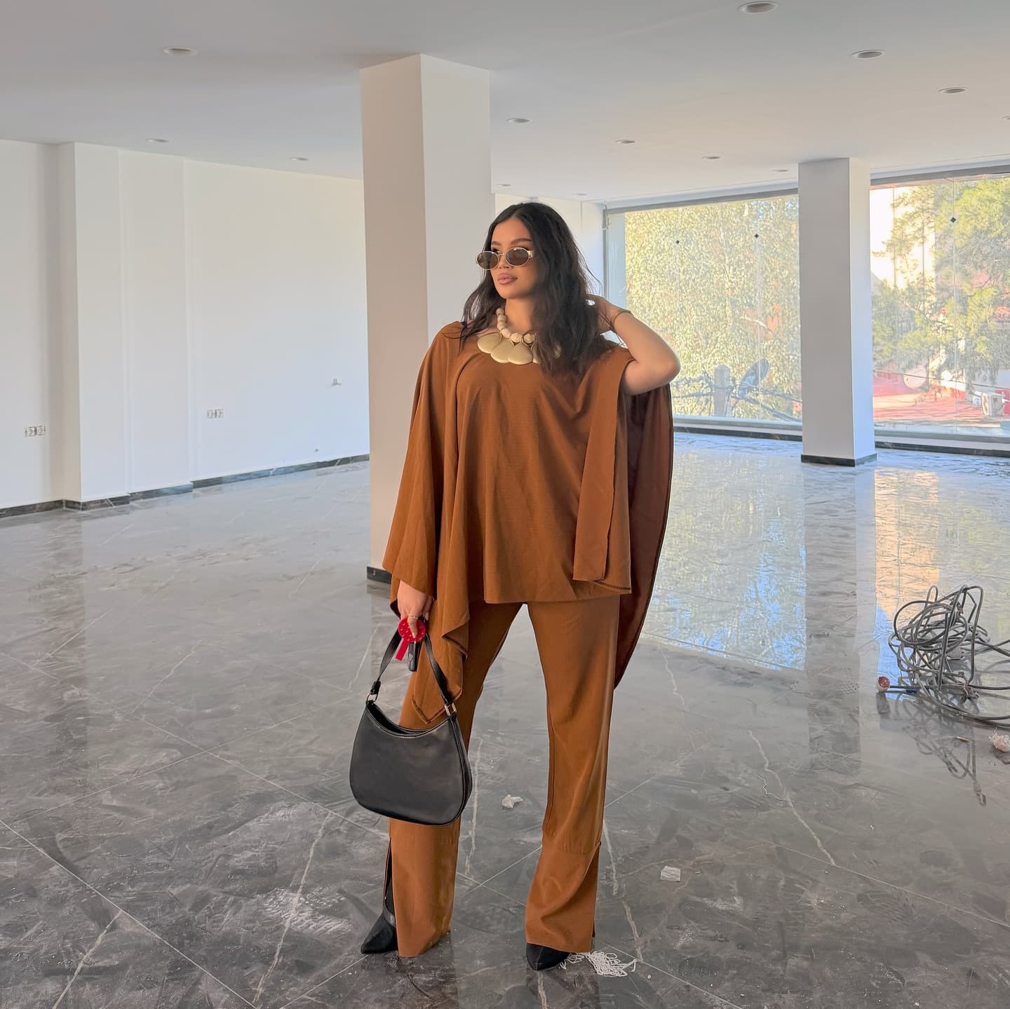 Caramel cape-sleeve top and wide-leg trousers, styled full look